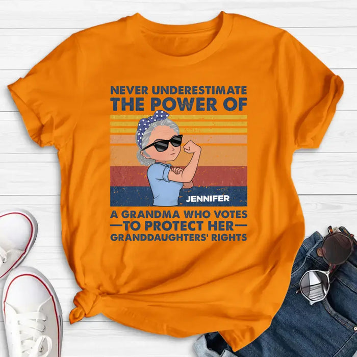 Personalized Grandma Votes T-shirt/Long Sleeve/Sweatshirt/Hoodie - Gift Idea For Grandma - Never Underestimate The Power Of A Grandma Who Votes To Protect Her Granddaughters' Rights