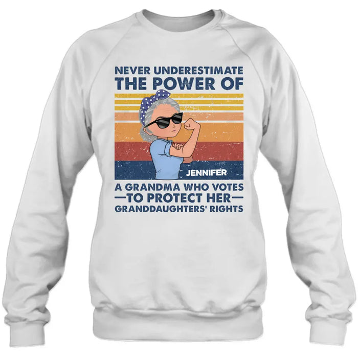 Personalized Grandma Votes T-shirt/Long Sleeve/Sweatshirt/Hoodie - Gift Idea For Grandma - Never Underestimate The Power Of A Grandma Who Votes To Protect Her Granddaughters' Rights