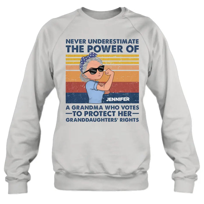 Personalized Grandma Votes T-shirt/Long Sleeve/Sweatshirt/Hoodie - Gift Idea For Grandma - Never Underestimate The Power Of A Grandma Who Votes To Protect Her Granddaughters' Rights